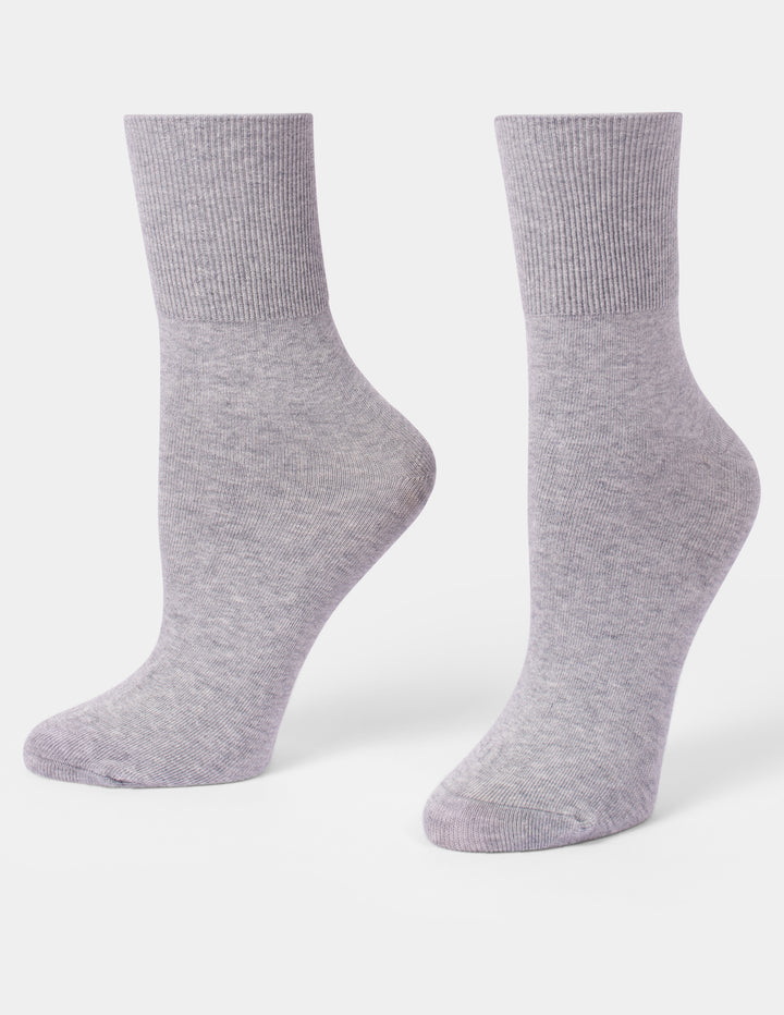 A pair of light heather gray crew socks displayed on foot forms against a clean white background.