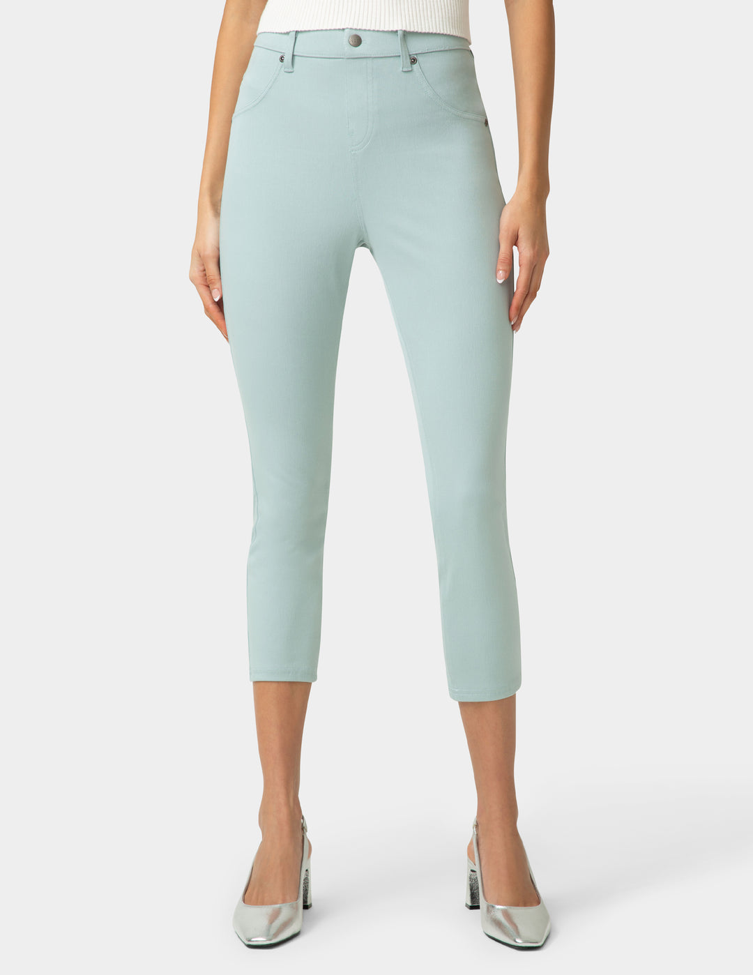 Light blue capri pants worn by a person on a white background