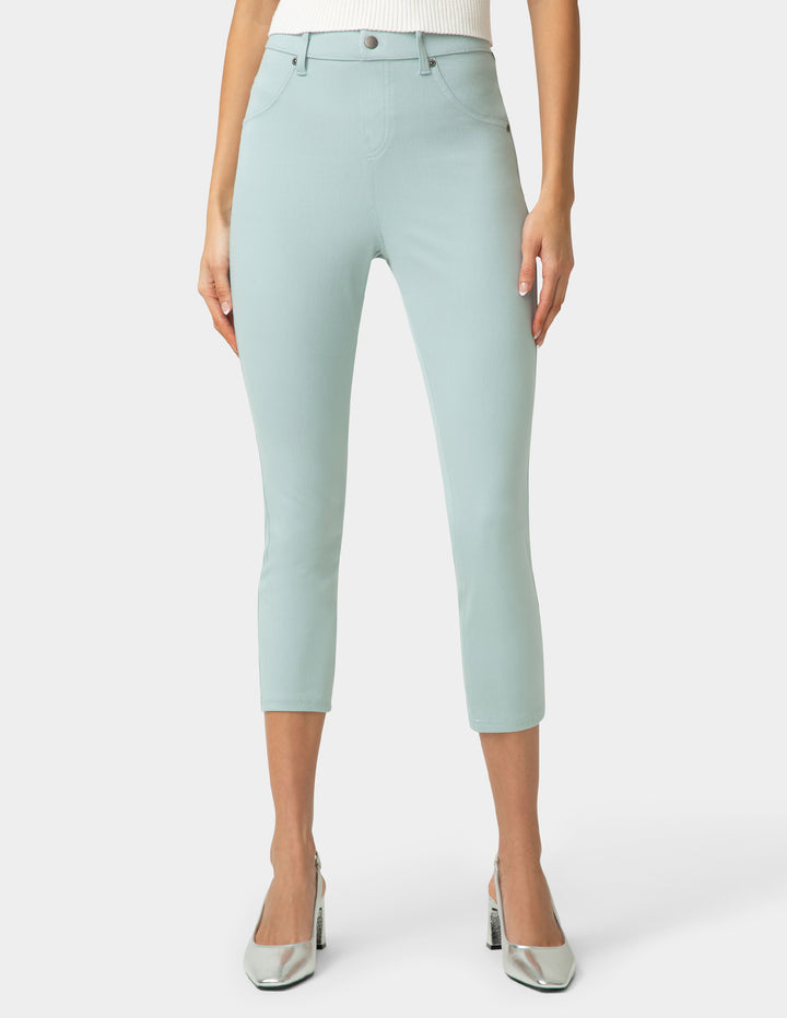 Light blue capri pants worn by a person on a white background