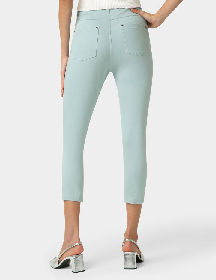 Light blue pants worn by a person on a white background