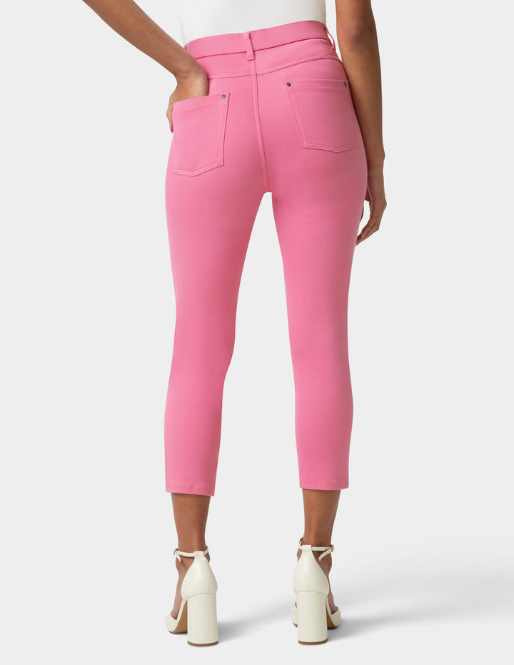 Pink pants worn by a person on a white background