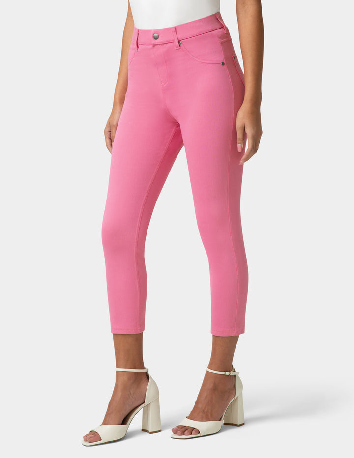Pink pants worn by a person on a white background