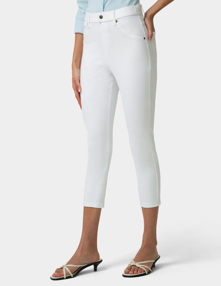 White pants worn by a person on a white background