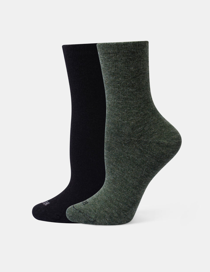 Two crew socks shown on invisible forms against a plain white background. One sock is solid black and the other is heather olive.