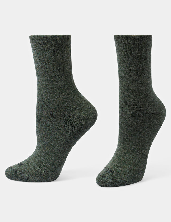 A pair of dark olive green crew socks displayed on invisible forms against a light gray background.