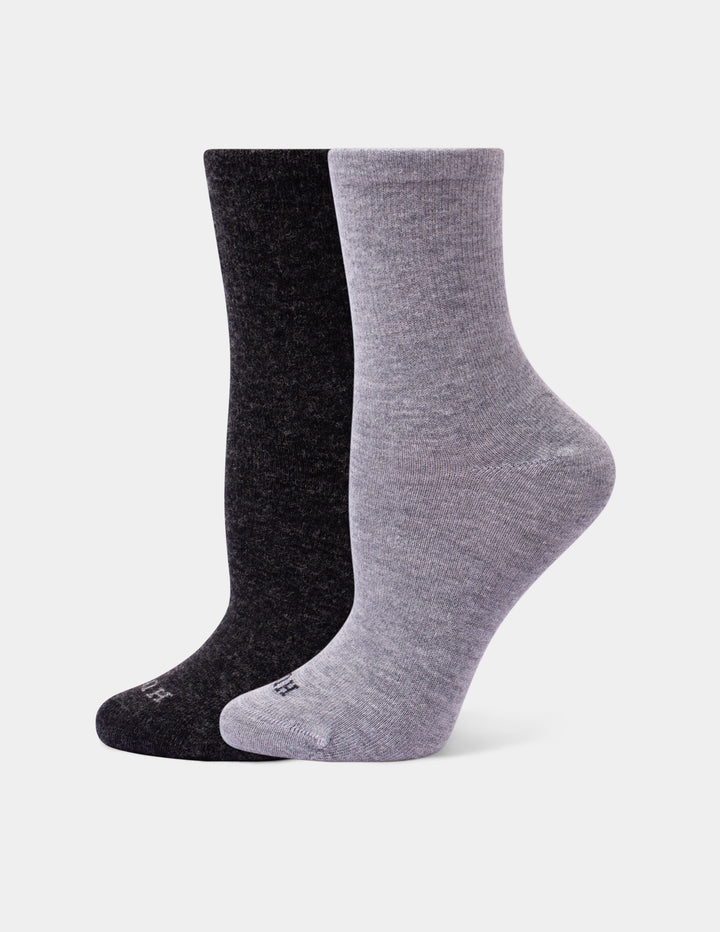 Two crew socks in heathered black and light gray, arranged overlapping on a light gray background.