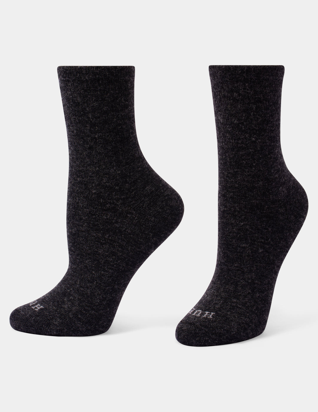 A pair of dark charcoal heather crew socks shown from the side against a light gray background.
