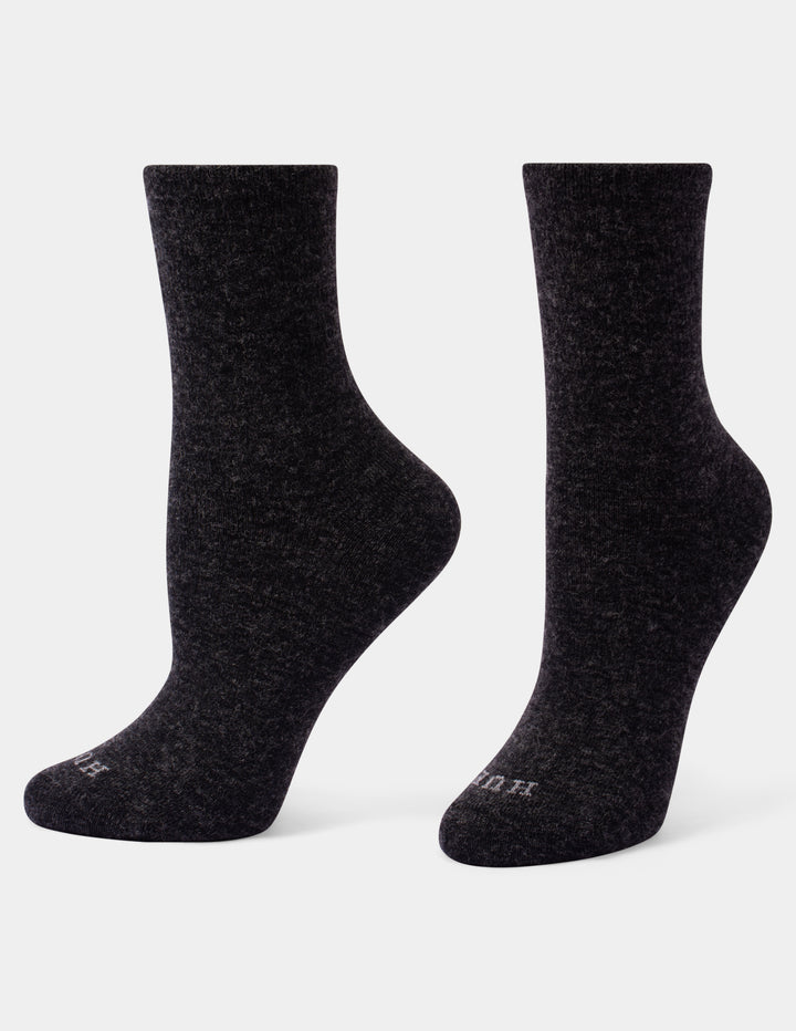 A pair of dark charcoal heather crew socks shown from the side against a light gray background.