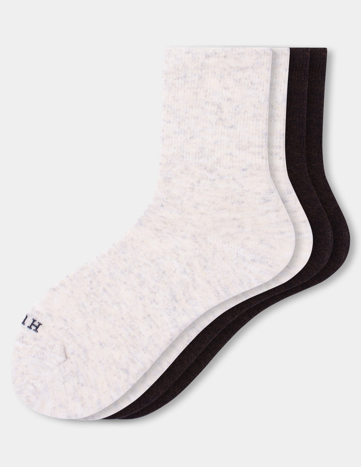 Two pairs of crew socks arranged in an overlapping fan shape on a light gray background. The front sock is a light heathered off-white, and the back sock in an espresso color.