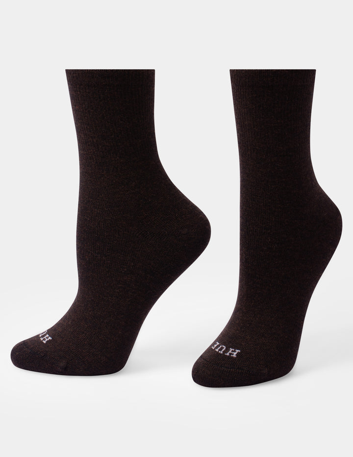 A pair of dark brown crew socks shown from the back against a light gray background.