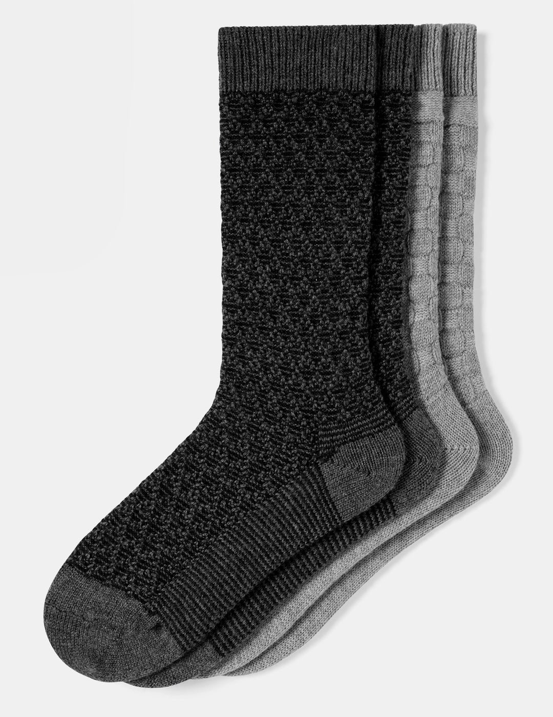 Two pairs of textured crew socks fanned out on a white background, featuring a black front pair and light gray pair behind it.