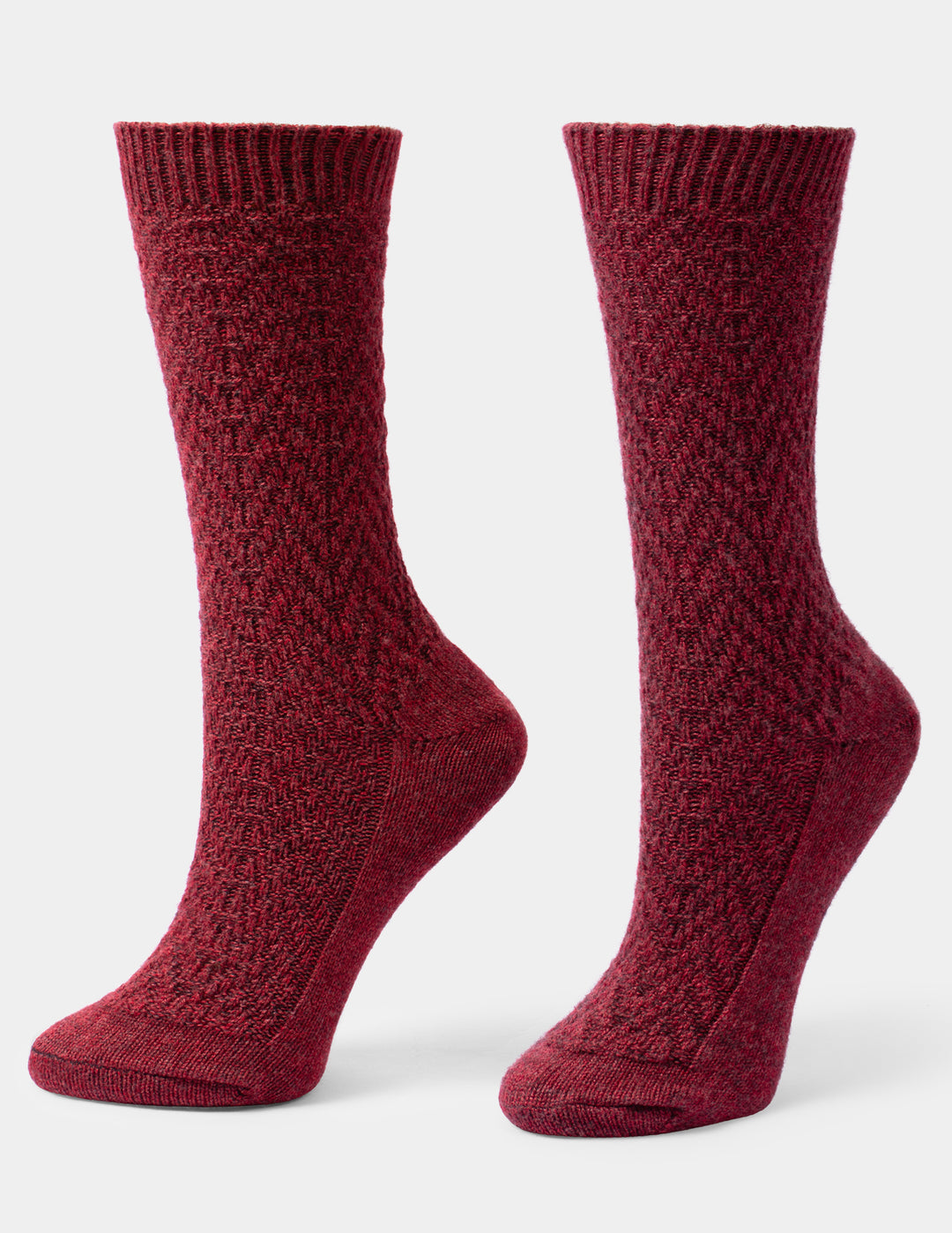 A pair of heathered burgundy crew socks with a textured knit pattern, shown on a light gray background.