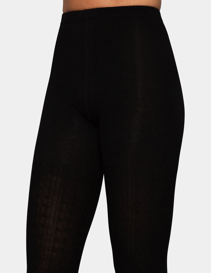 A close up of model wearing black tights