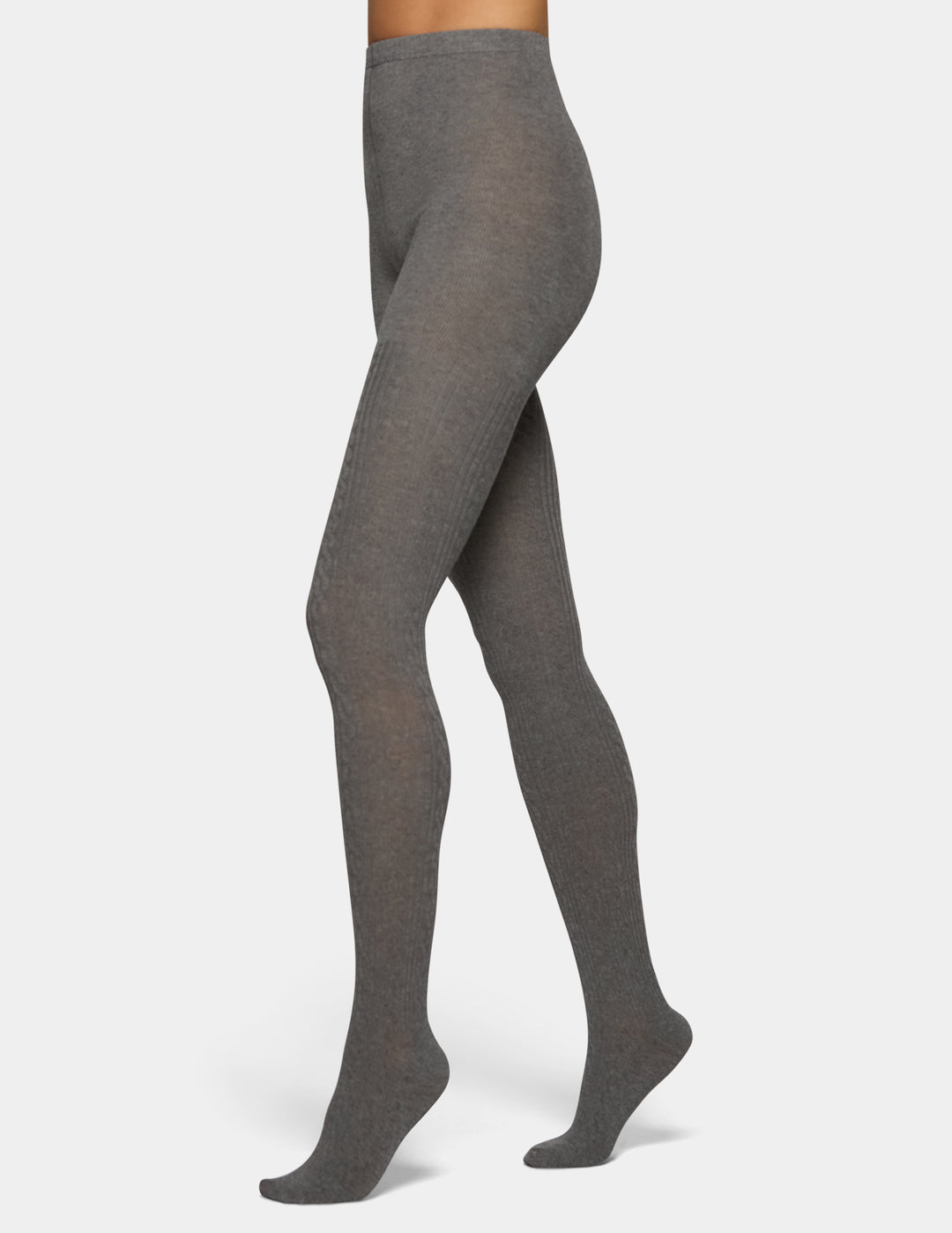 A model wearing grey tights from the waist down against a light grey background