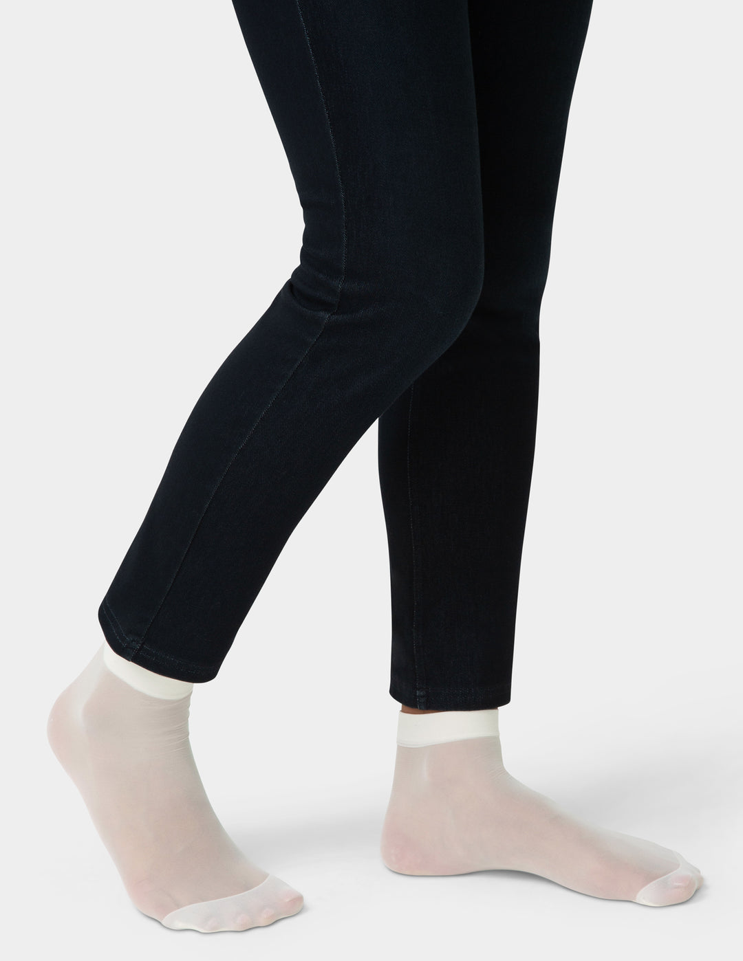 Person wearing pair of ivory sheer socks