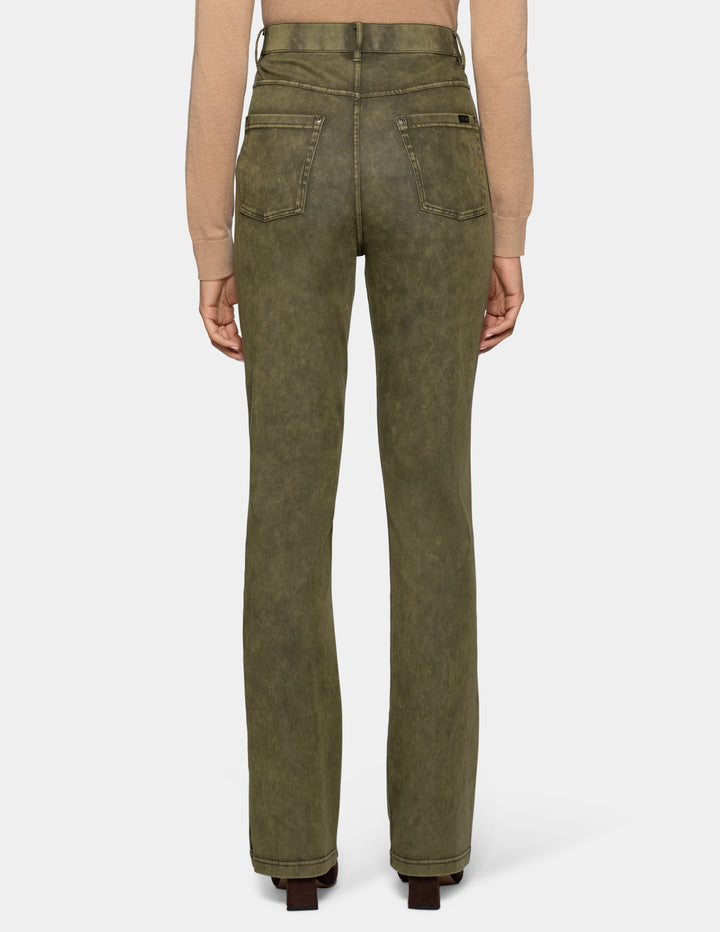 A model from the backside wearing olive green bootcut jeans, styled with a beige long-sleeve top and dark brown pointed-toe boots against a light gray background.