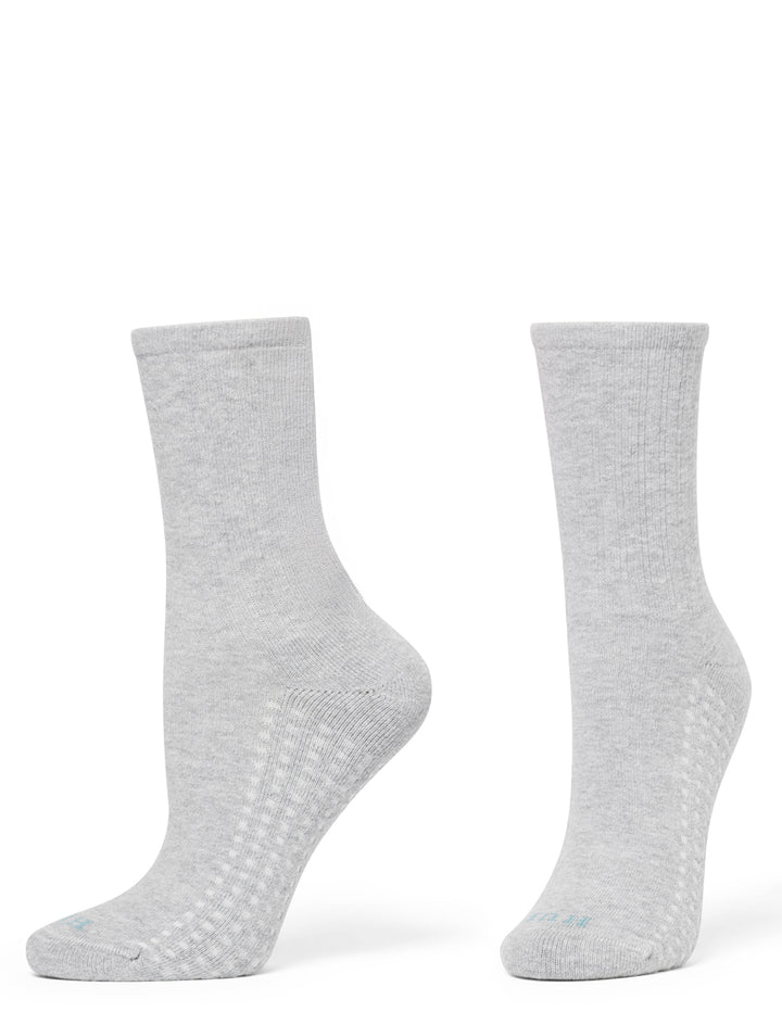 A pair of light gray heather crew socks shown from the side and back on a plain white background.