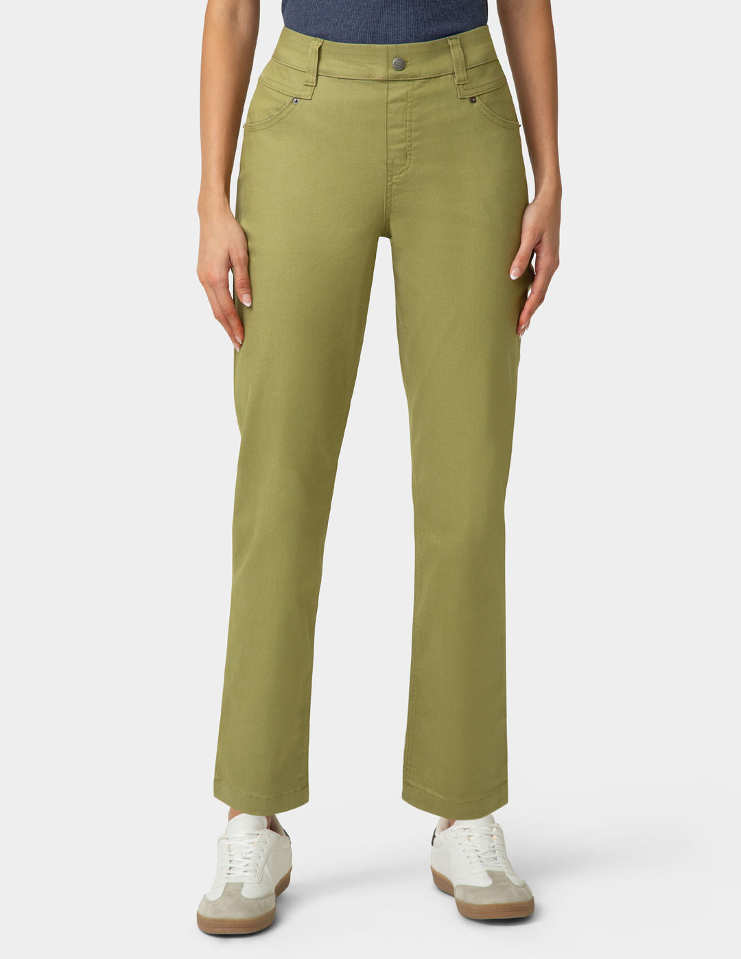 Person wearing olive green pants on a white background