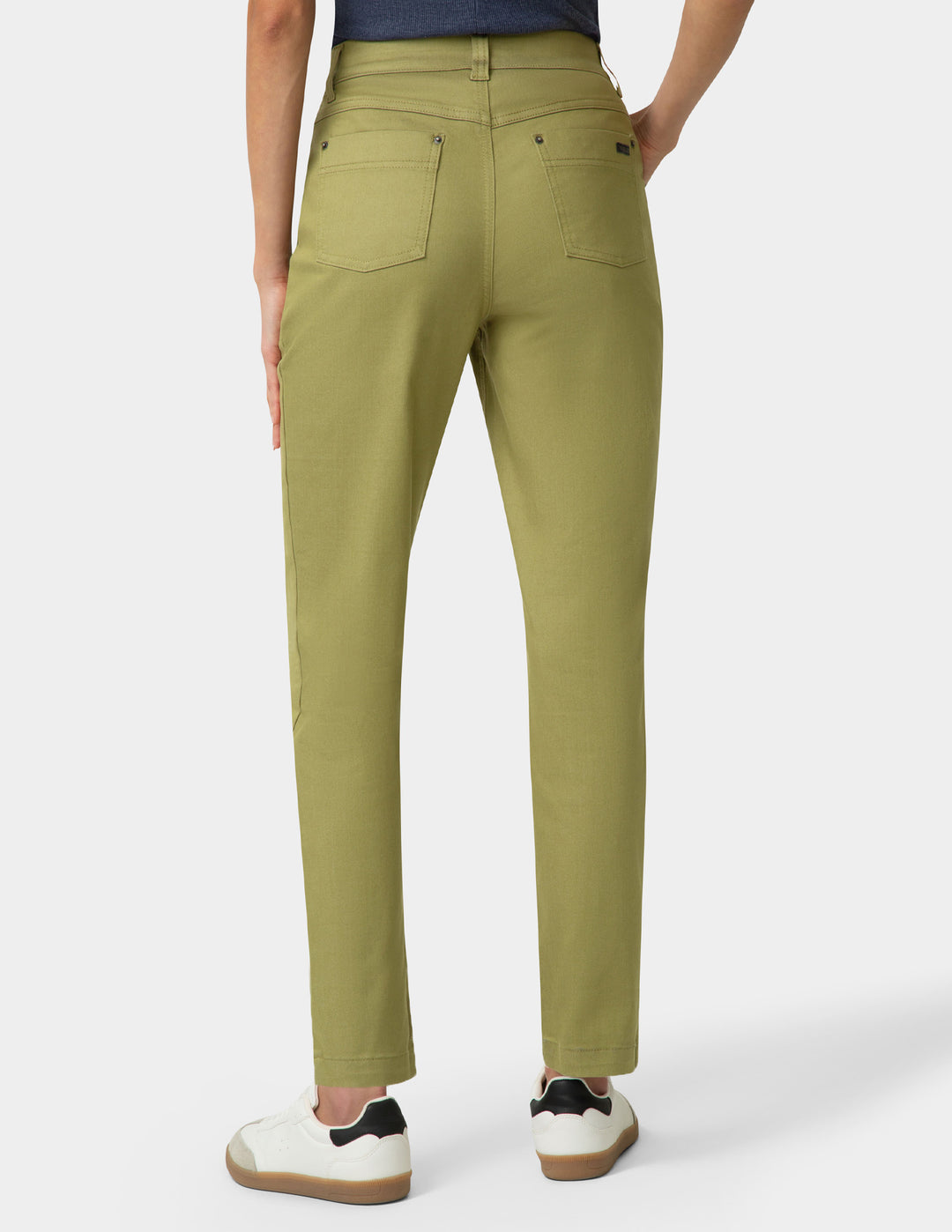 Person wearing green pants on a white background