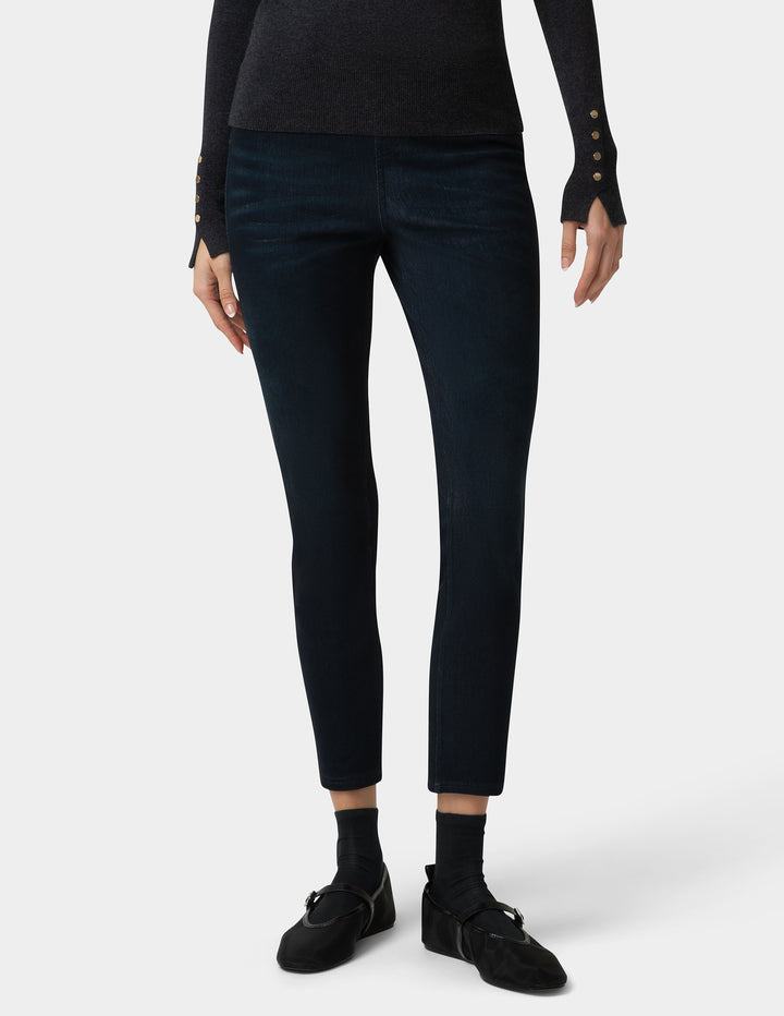 Person wearing black pants and shoes on a white background