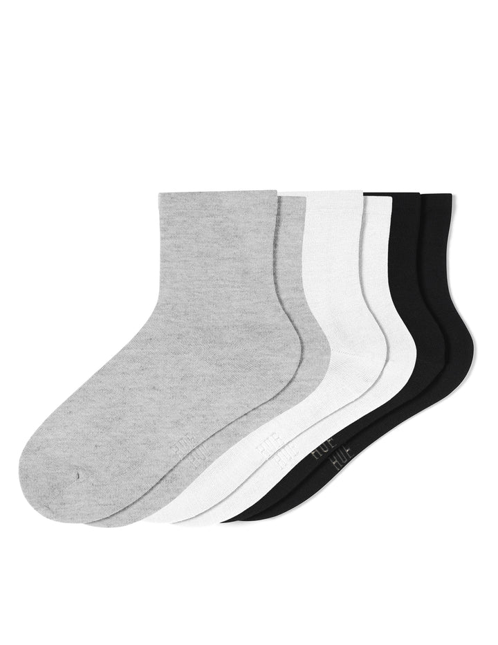 Set of gray, white, and black socks on a white background