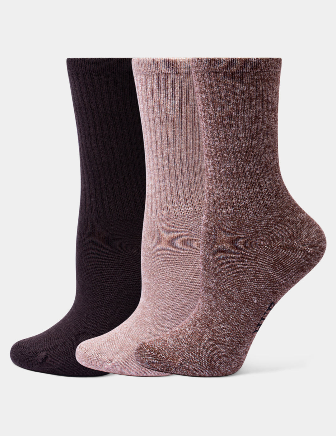 Three pairs of ribbed crew socks in dark brown, dusty pink, and heathered mauve, arranged side-by-side against a light gray background.