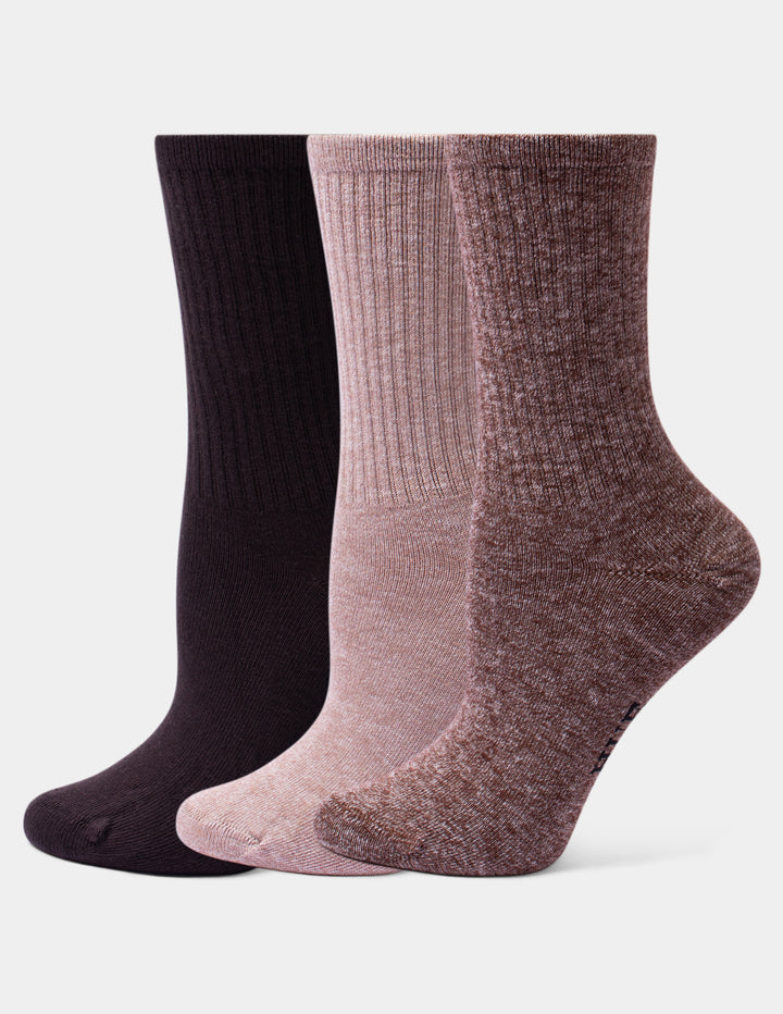 Three pairs of ribbed crew socks in dark brown, dusty pink, and heathered mauve, arranged side-by-side against a light gray background.