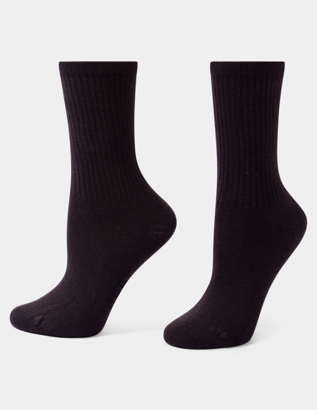 A pair of dark brown ribbed crew socks shown from the side against a light gray background.