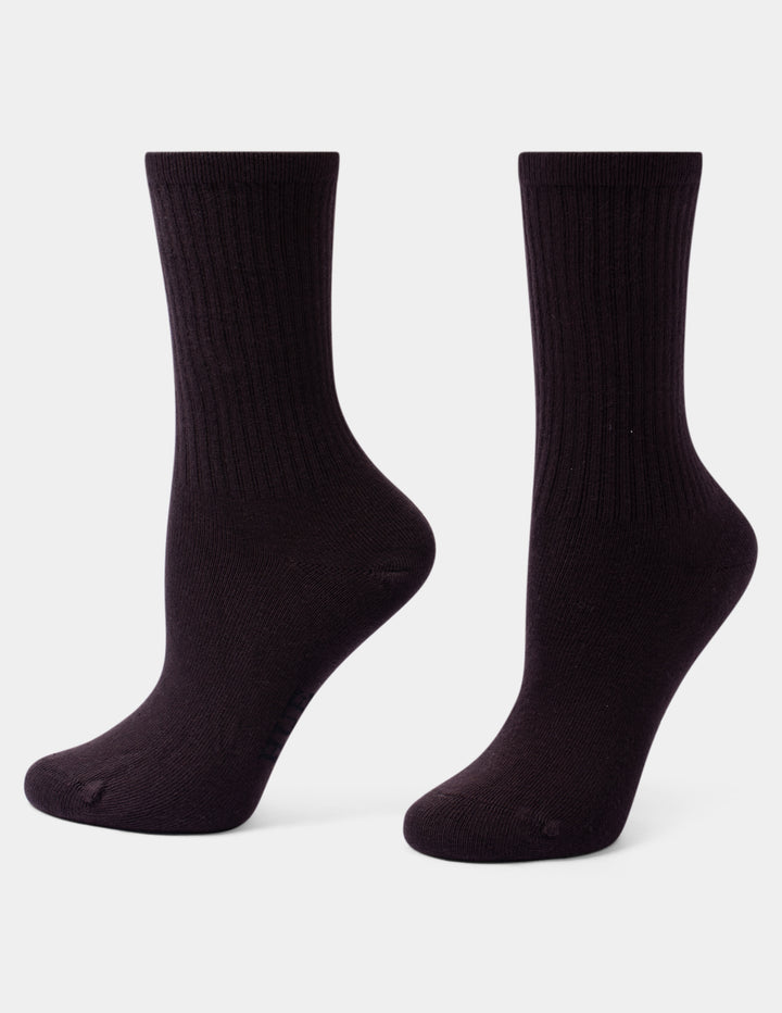 A pair of dark brown ribbed crew socks shown from the side against a light gray background.
