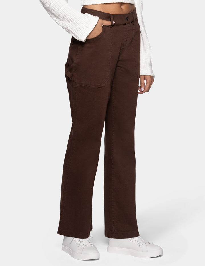 A person wearing dark brown wide-leg pants sideview