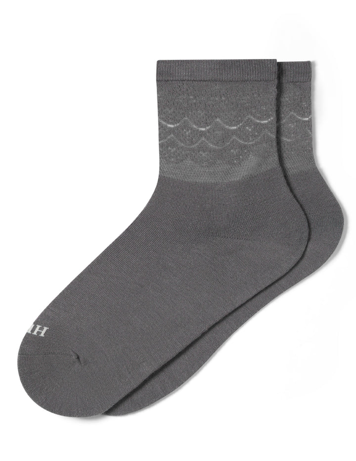Gray sock with lace pattern on a white background