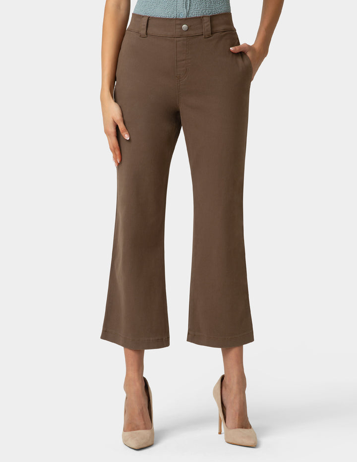 Brown pants worn by a person on a white background