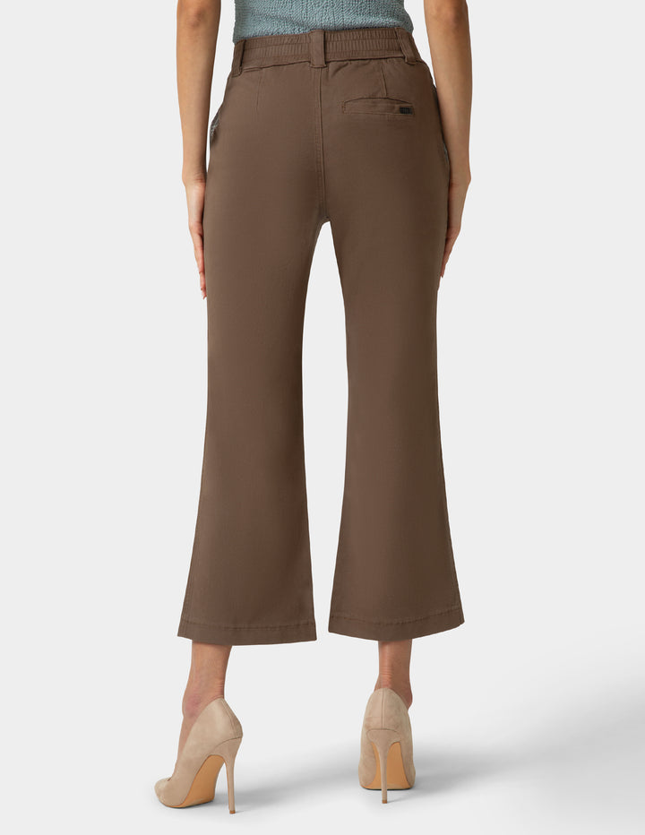 Brown wide-leg pants worn by a person on a white background