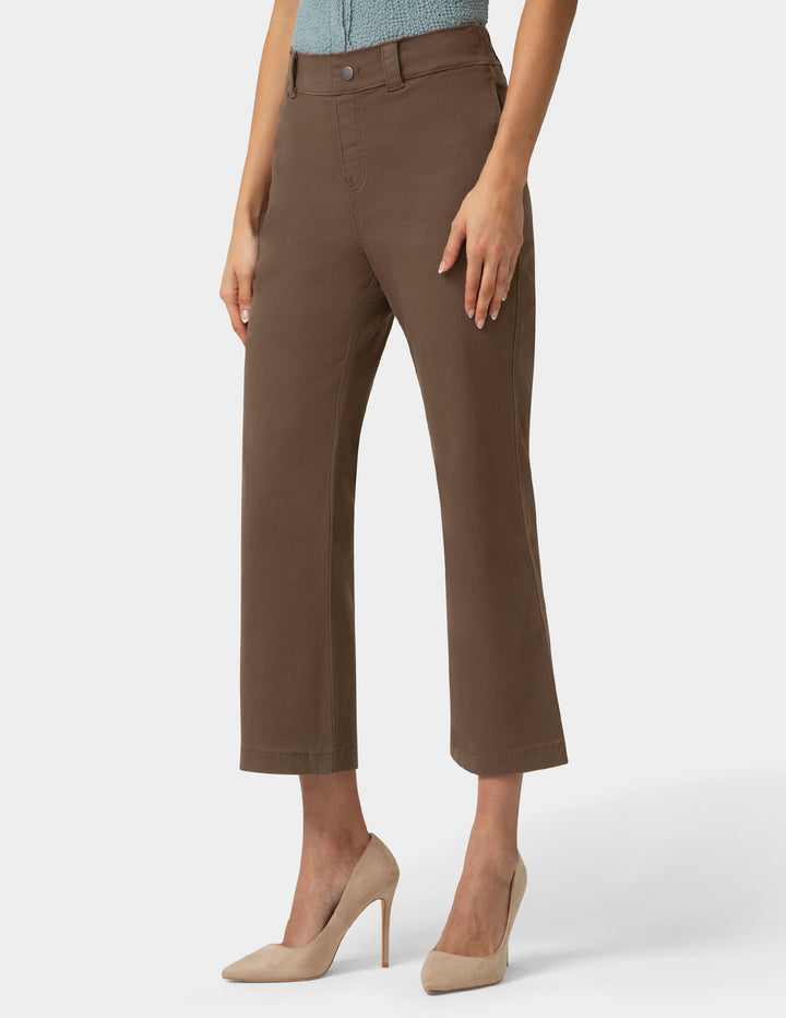 Brown pants worn by a person on a white background