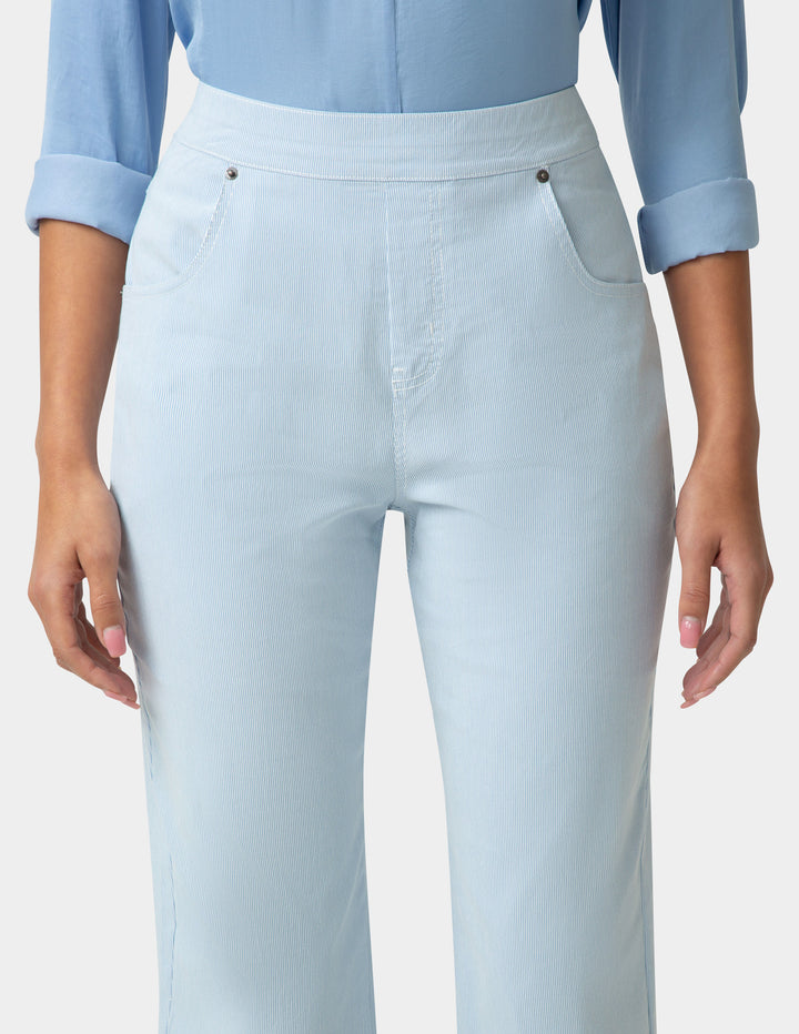 Light blue pants worn by a person on a plain background