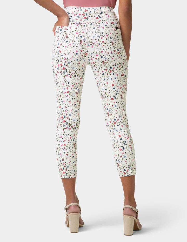Floral-patterned pants worn by a person on a white background