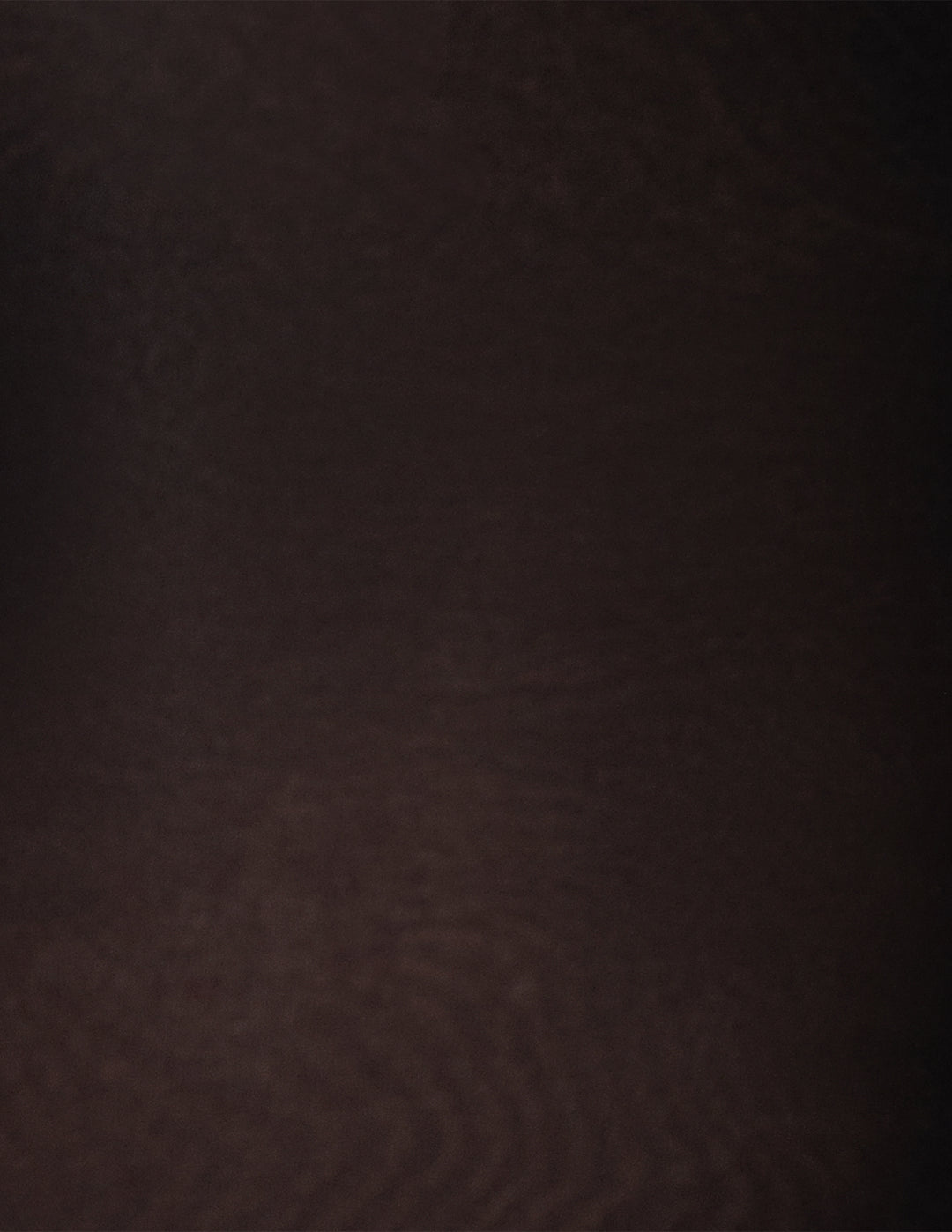 A close-up of a black textured material fabric.
