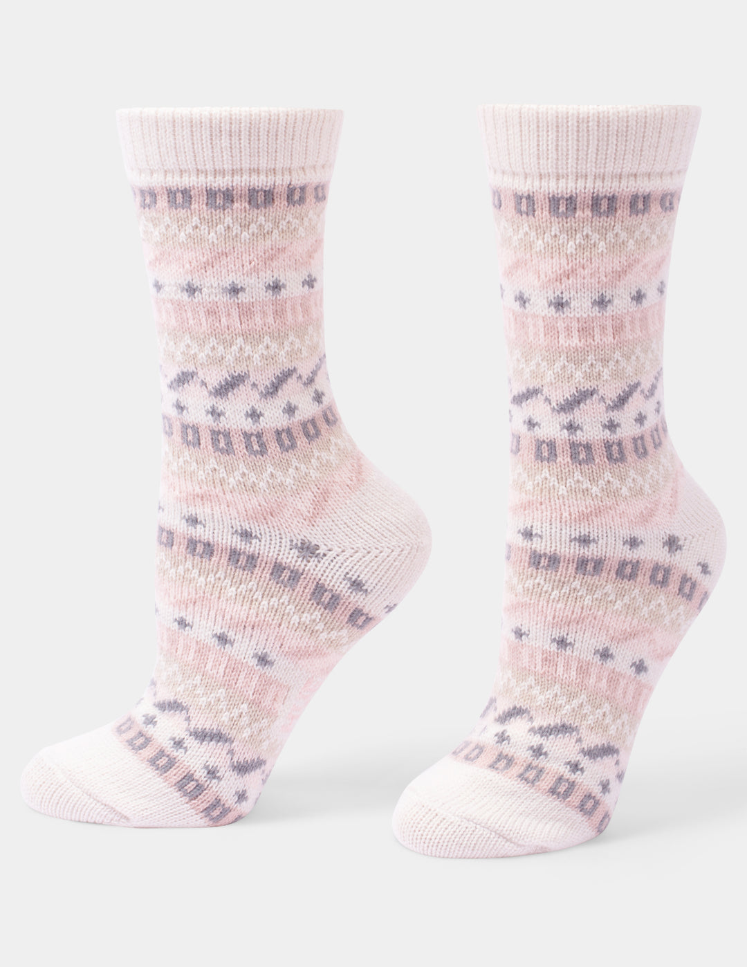 An ivory pair of crew socks with pink and grey patterns on a light gray background.