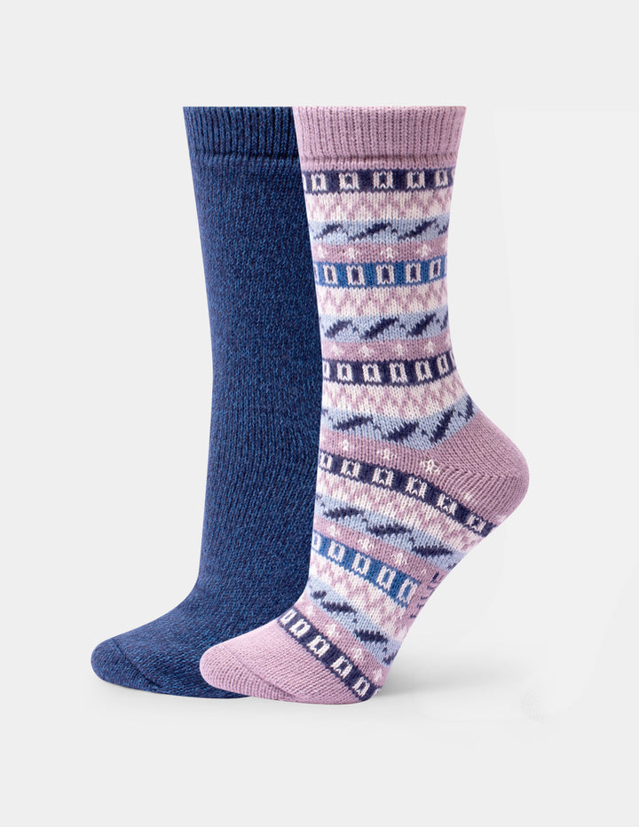 Two pairs of crew socks, one in a dusty pink color with a geo pattern, and the other in a plain blue color, against a light gray background.