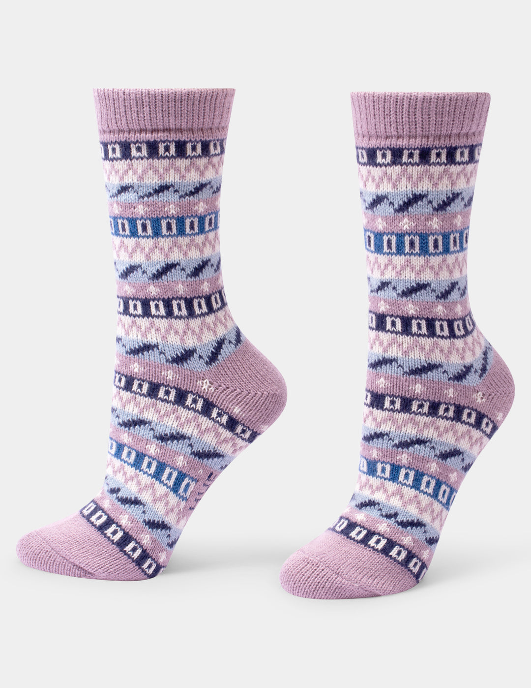 A pair of crew socks with a Fair Isle pattern in lavender, pink, and navy blue, shown against a plain light gray background.