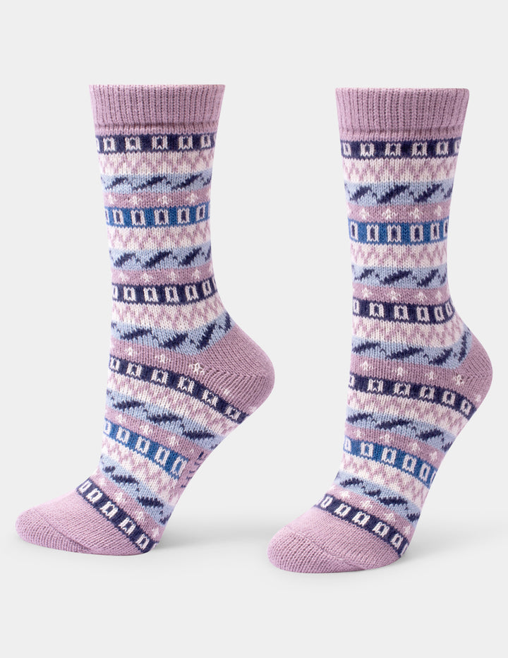 A pair of crew socks with a Fair Isle pattern in lavender, pink, and navy blue, shown against a plain light gray background.
