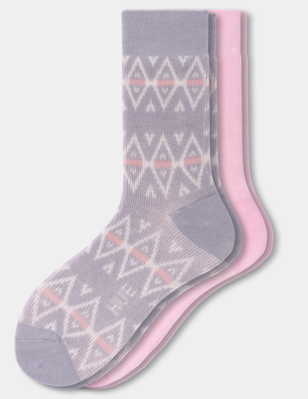 Two crew socks stacked together on a light gray background. The front sock is light gray with a white geometric diamond pattern and thin pink horizontal stripes, while the back two socks are solid light pink.