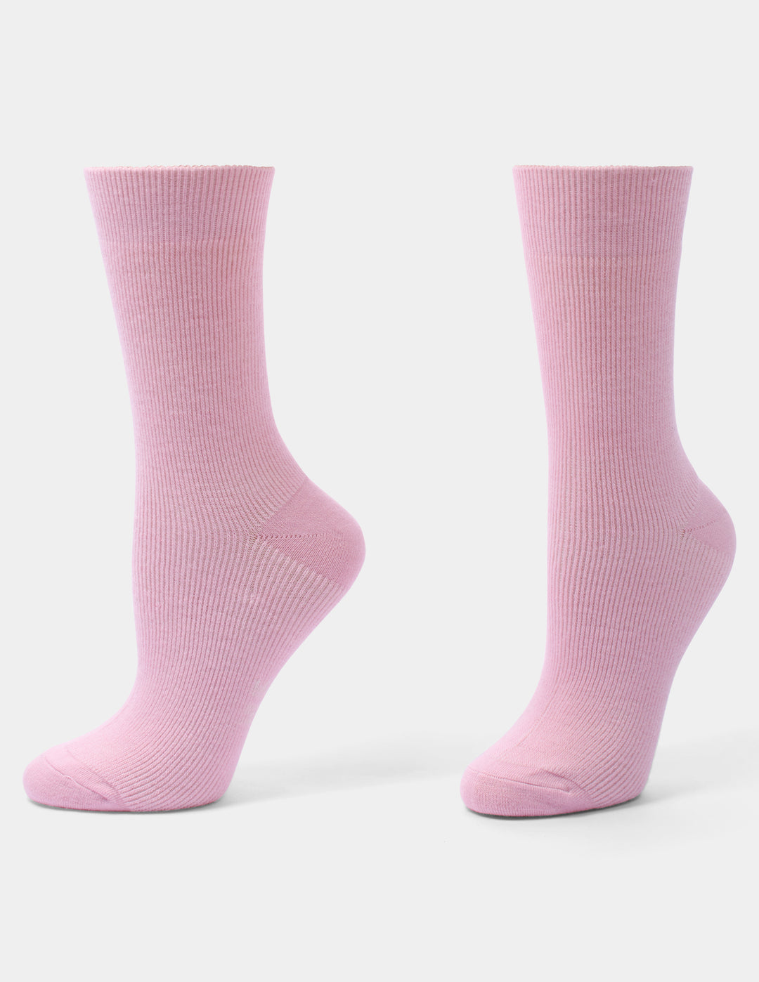 A pair of light pink ribbed crew socks shown from the side against a clean, light gray background.