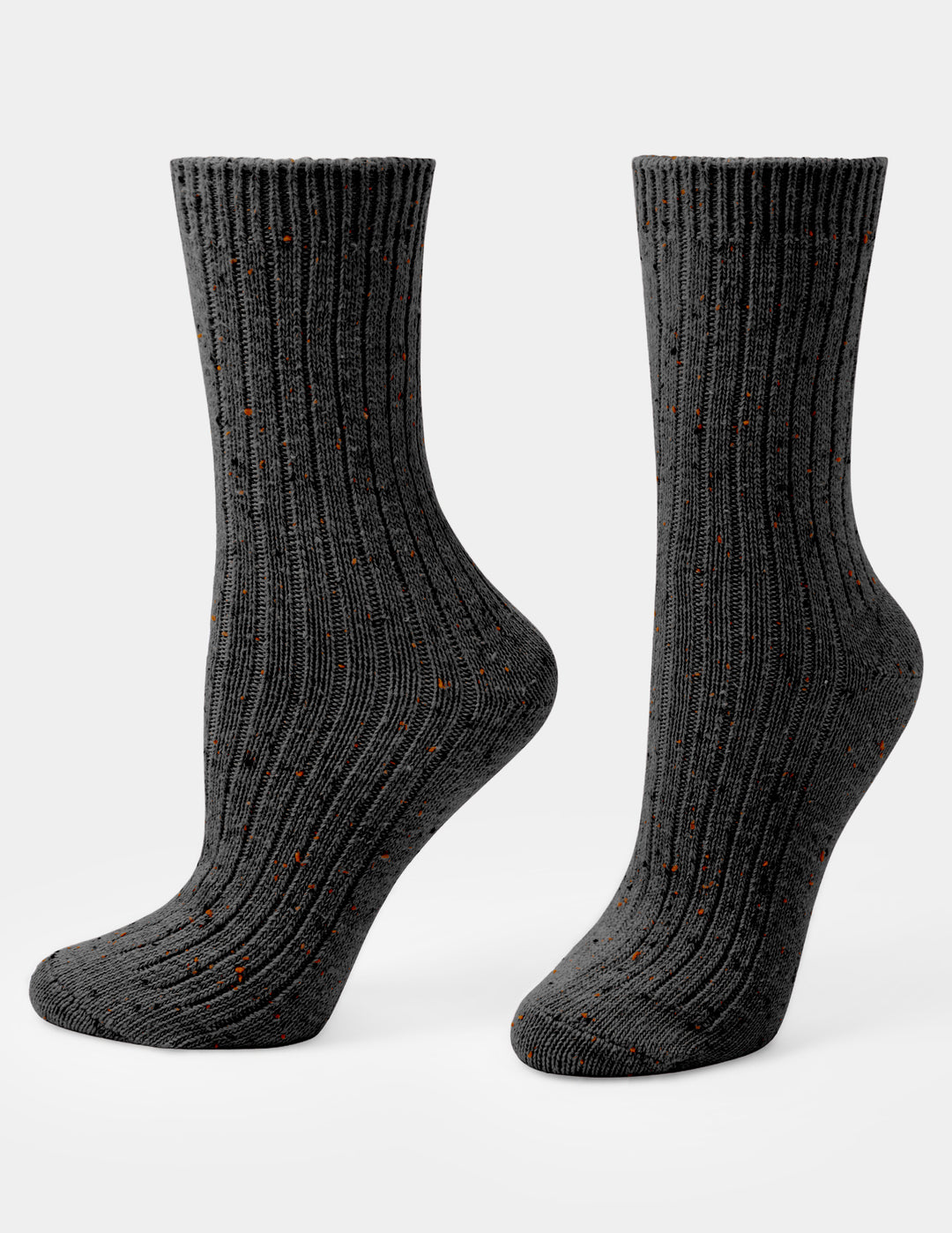 A pair of dark charcoal gray ribbed crew socks with small orange speckles, shown on a light gray background.