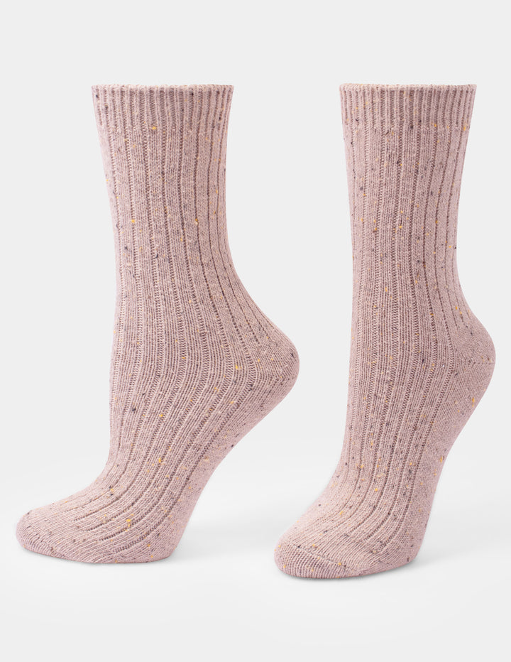 A pair of light pink tweed crew socks displayed against a light gray background.