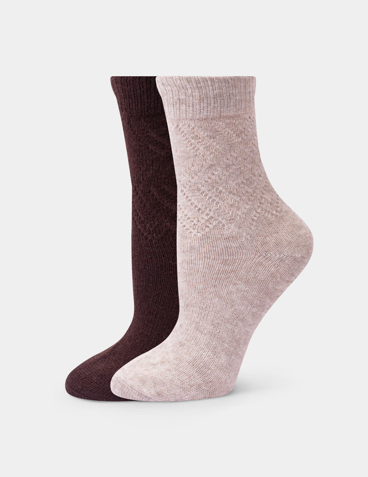 Two ankle socks shown on invisible forms against a light gray background. The front sock is a light heathered beige with a textured knit pattern, and the back sock is a dark chocolate brown.