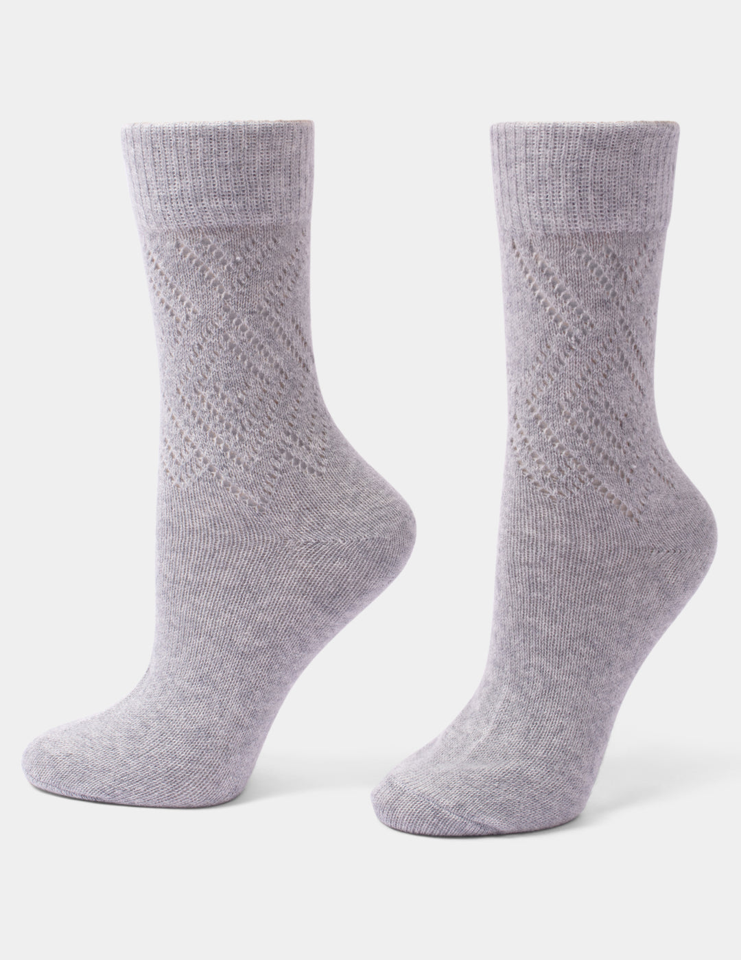 A pair of light gray heather crew socks with a textured knit pattern on the sides, displayed on invisible forms against a clean white background.