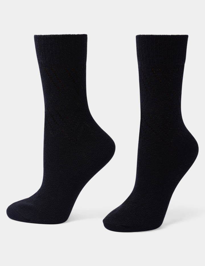 A pair of black crew socks displayed on invisible forms against a plain white background.