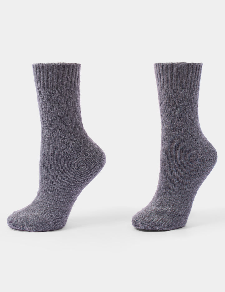 A pair of heather gray ribbed knit sock shown against a plain light gray background.
