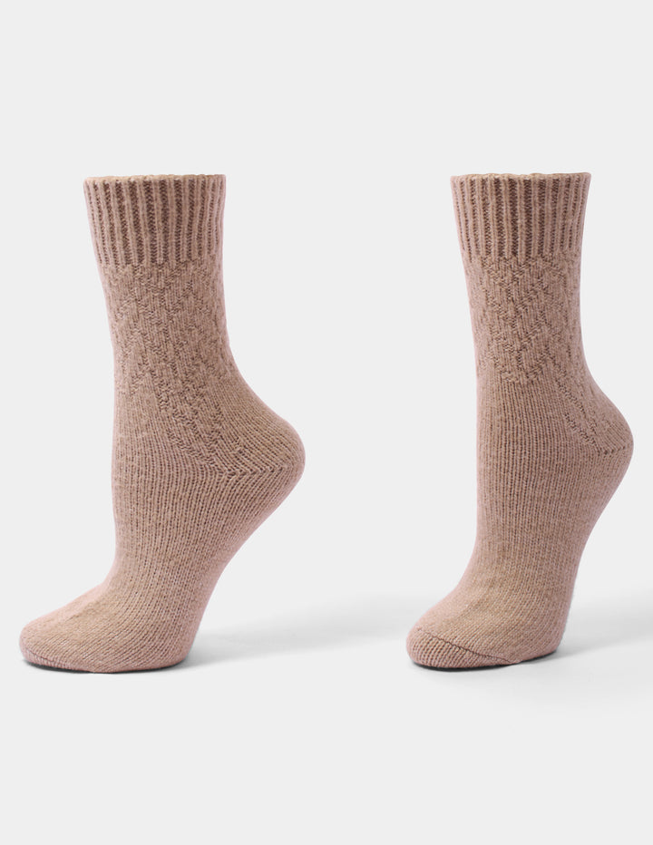 A pair of ribbed mid-calf socks in a taupe color, displayed from the side on a clean, light gray background.